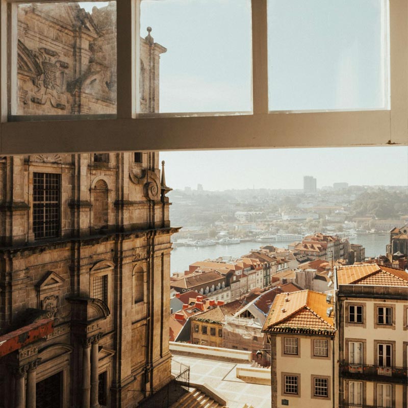 Point of view: Looking out of an open window onto the city of Porto, Portugal.